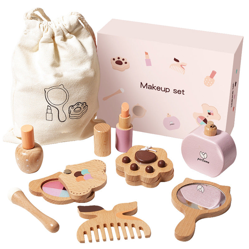 Children's makeup set with wooden and pink items, including a mirror, bottles, and a pouch on a white background.