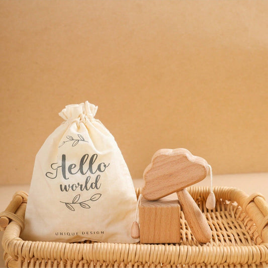 White drawstring bag with 'Hello world' text on a woven basket against a beige background