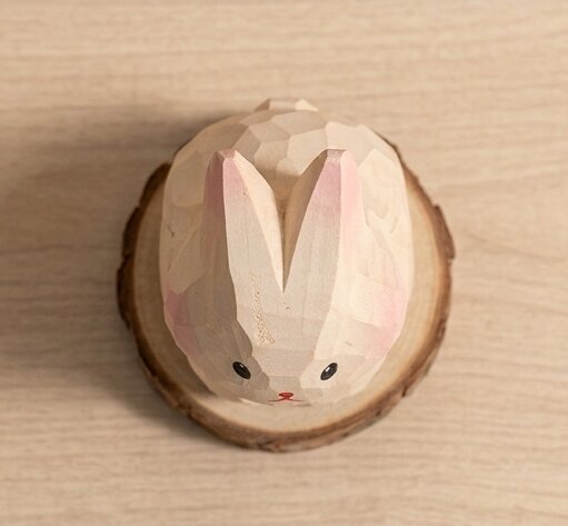 Top detail view wooden rabbit sheep toy showing hand carved texture, non-toxic stained natural wood eco-friendly figurine, sustainable wooden animal toy gift for children ages 1-5 years