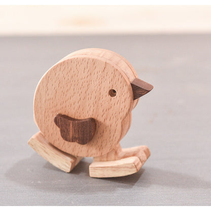 Gravity powered walking chicken made of beechwood for cause and effect play.