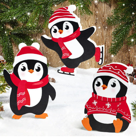 Three cartoon penguins wearing winter hats and scarves on a snowy background with Christmas trees.