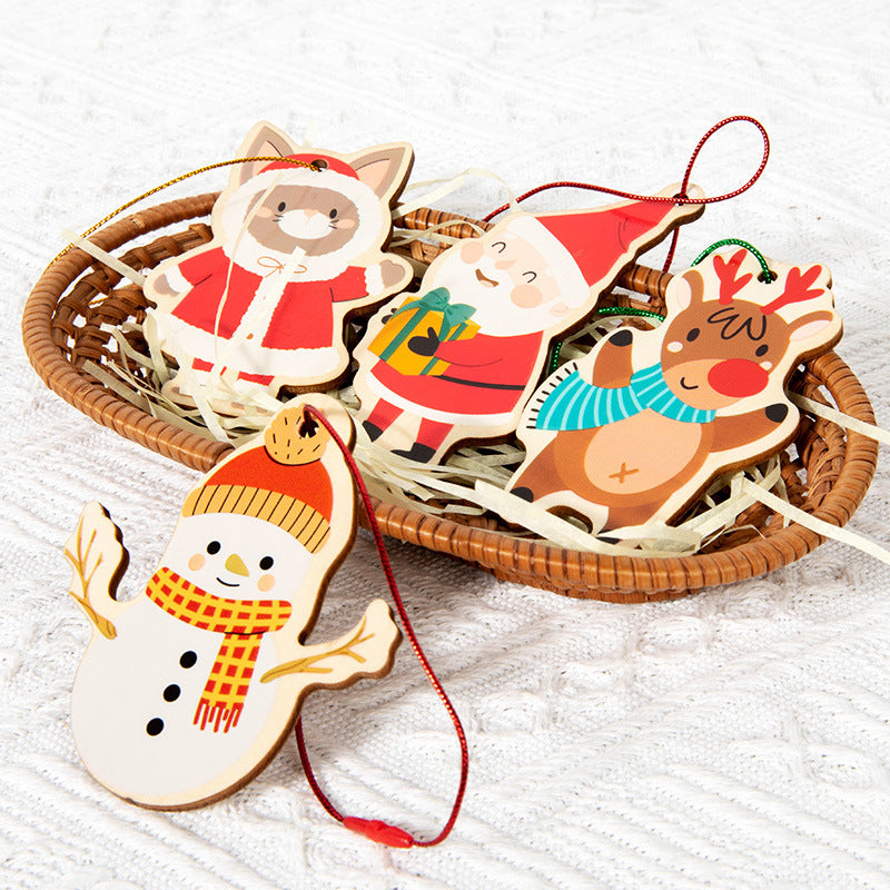 Wooden Christmas ornaments shaped like a snowman, reindeer, and Santa Claus in a wicker basket on a white background.
