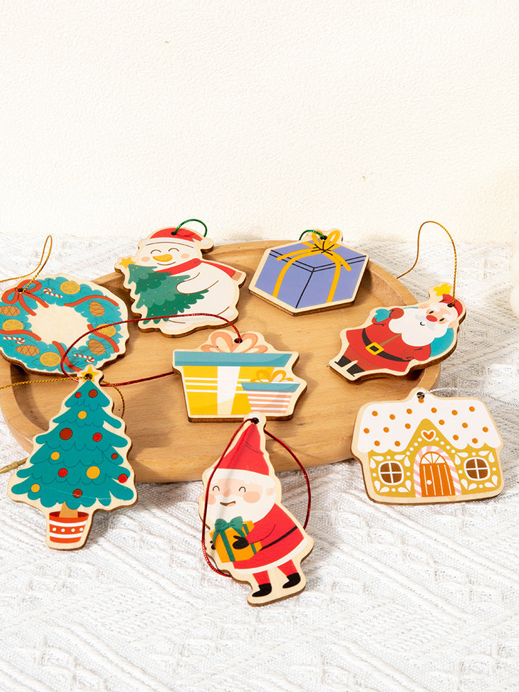Set of colorful Christmas-themed wooden ornaments on a white surface.