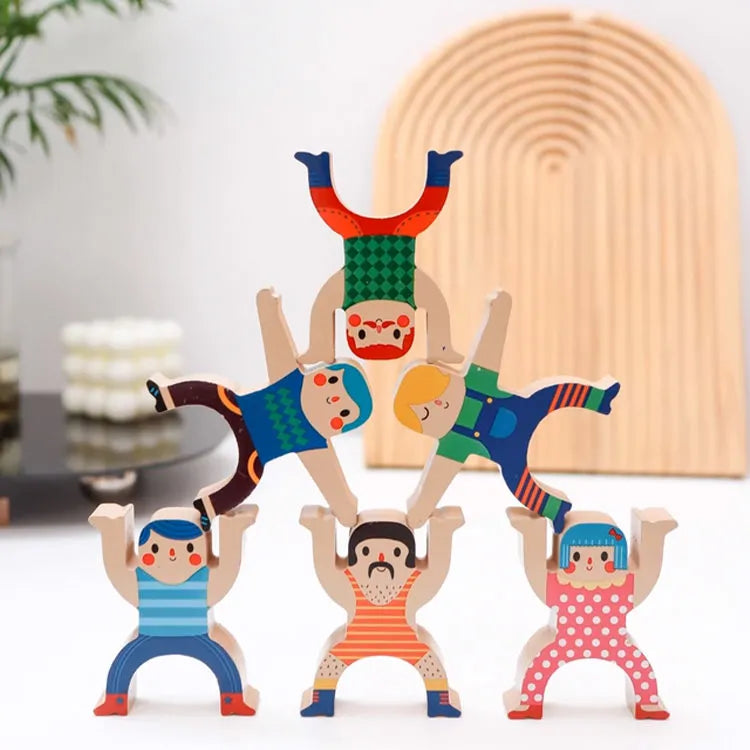 Colorful wooden acrobats toy set on a white background