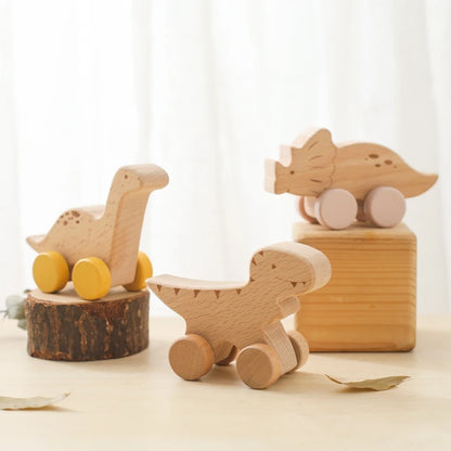 Three wooden toys on a light surface with a white curtain background