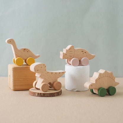 Set of wooden animal toys on a neutral background