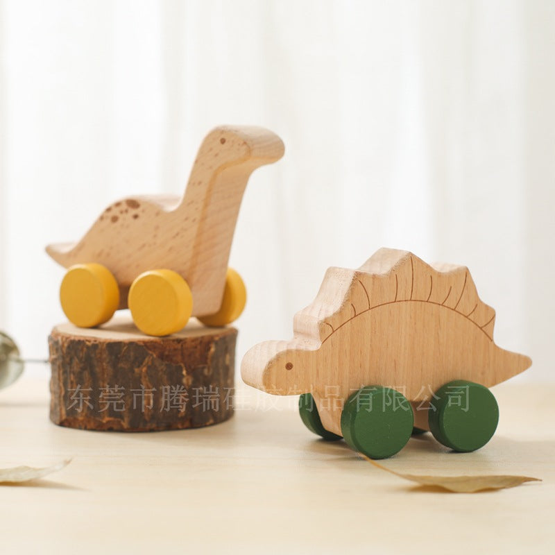 Two wooden dinosaur toys on a light background