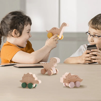 Two children playing with wooden toy animals on a table.