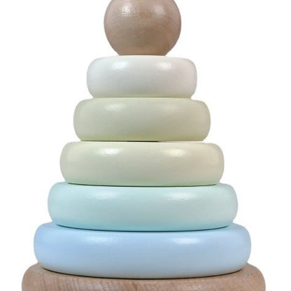 Stack of wooden rings in pastel colors on a white background
