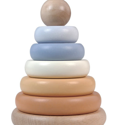 Stack of wooden rings in various colors on a white background