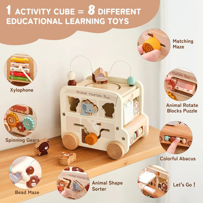Wooden activity cube with educational toys and features on a white background