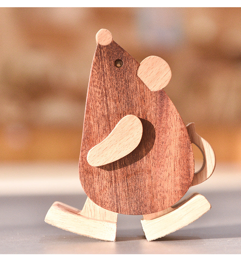 Mechanical gravity mouse ramp walker scurrying down a wooden slope.
