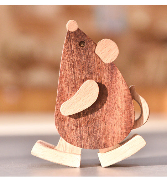 Mechanical gravity mouse ramp walker scurrying down a wooden slope.
