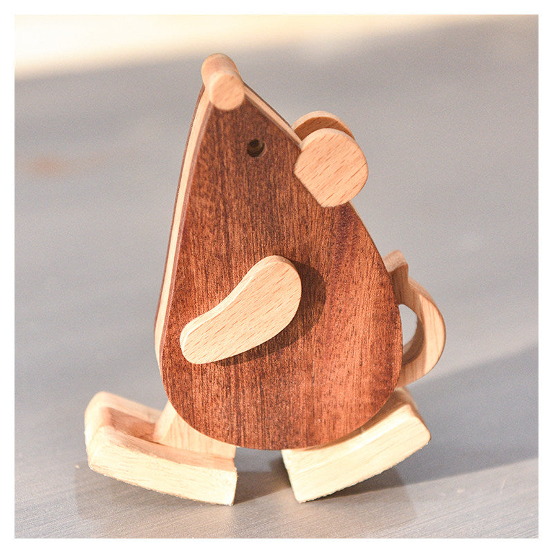 Precision carved wood mouse walking toy as a mechanical physics desk toy.