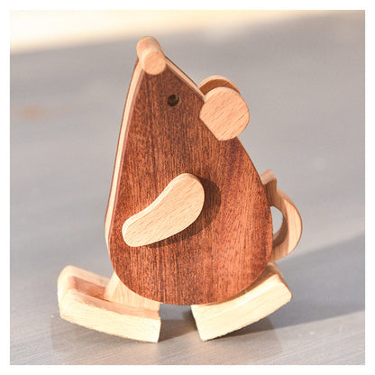 Precision carved wood mouse walking toy as a mechanical physics desk toy.