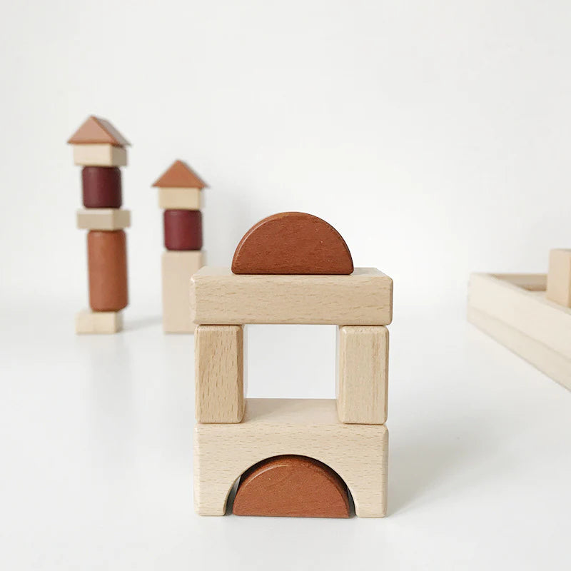 Wooden building blocks with brown and beige colors on a white background