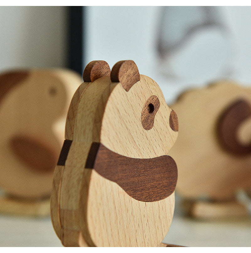 Wooden animal figurines on a light background