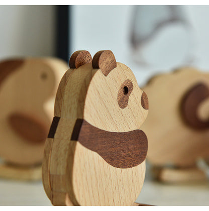 Wooden animal figurines on a light background