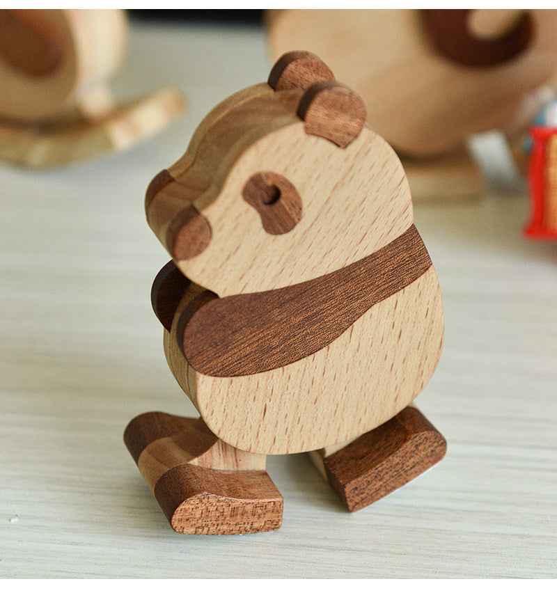 Wooden panda toy on a light surface