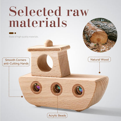 Wooden toy boat with acrylic beads and natural wood material details on a light gray background.