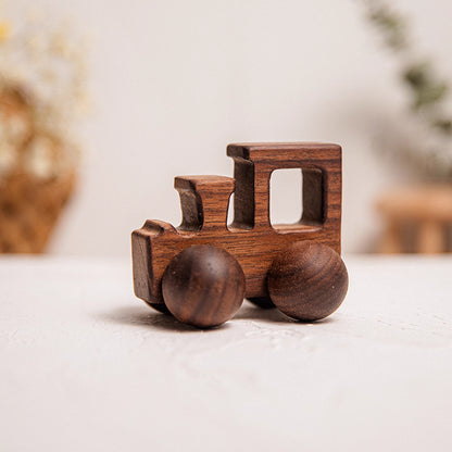 Wooden toy train on a light surface with a blurred background