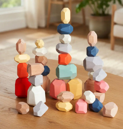 Colorful wooden stacking toys on a wooden surface with a blurred indoor background