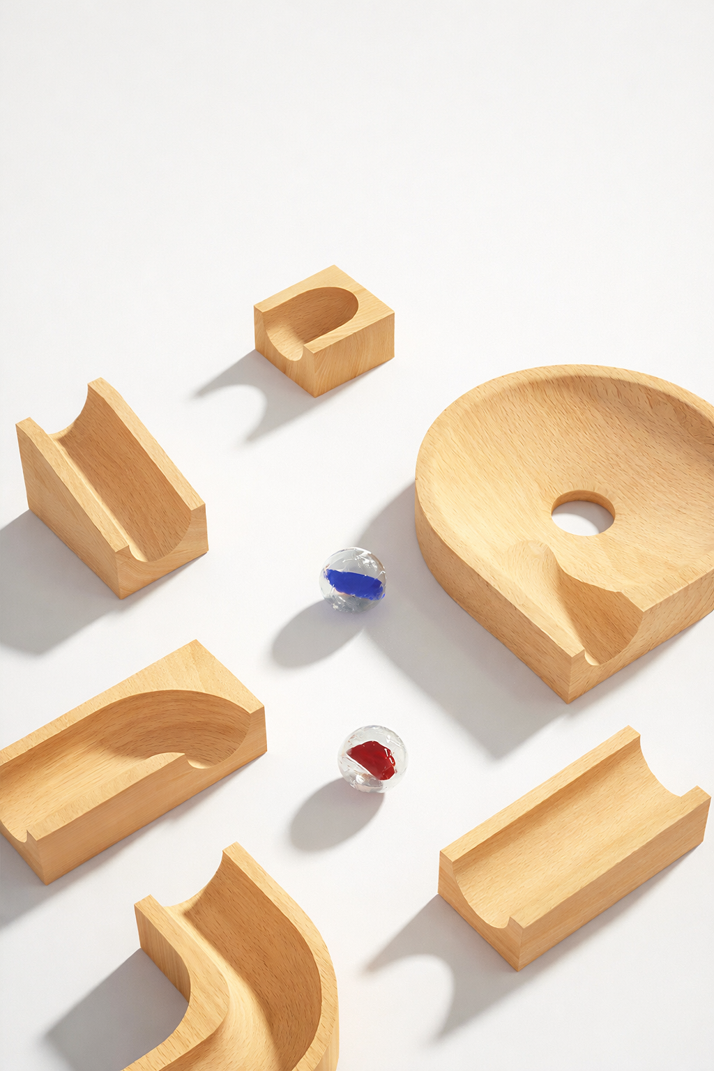 Montessori wooden marble track toy with natural wood blocks and colorful glass marbles