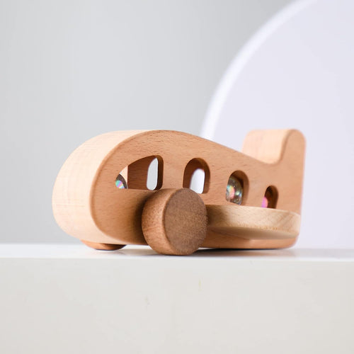 Wooden toy car on a light gray background