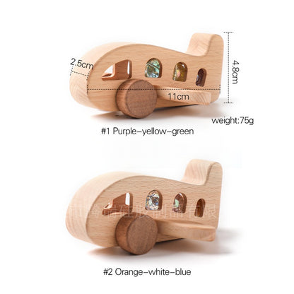 Wooden toy airplane with measurements and color options on a white background
