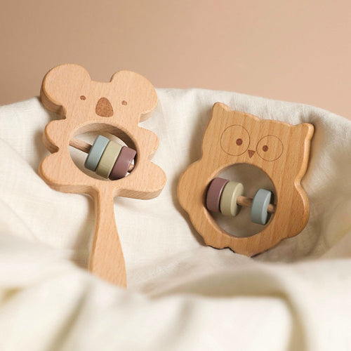 Wooden koala and owl baby rattle on beechwood ring