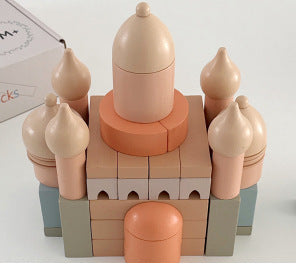 Toy building block set resembling a castle on a white background
