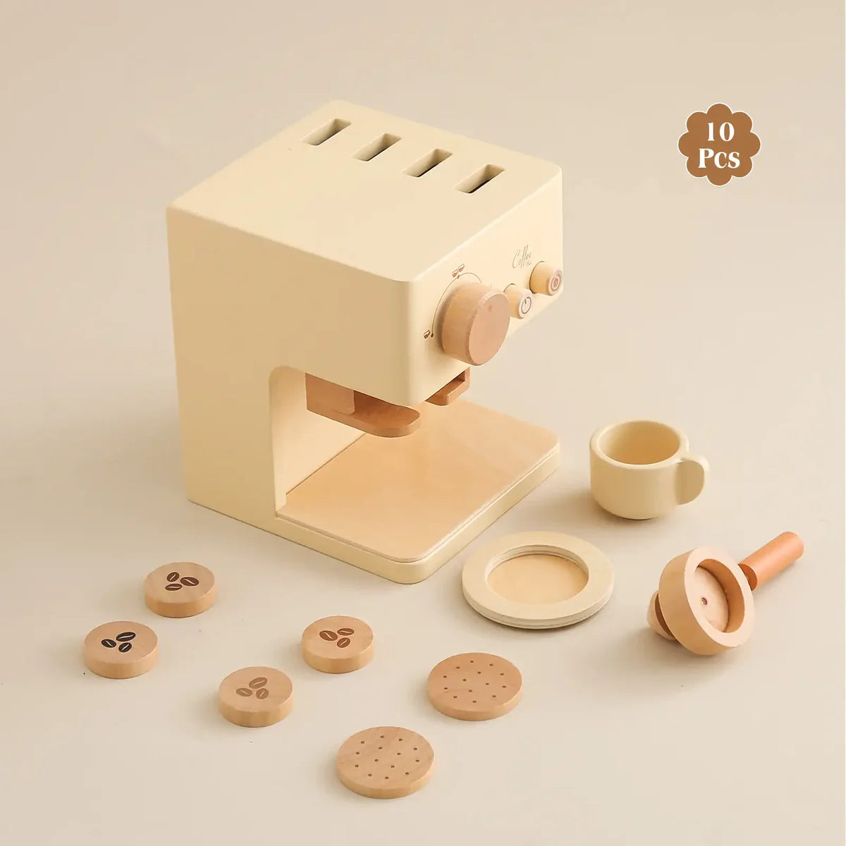 Wooden toy coffee maker set with accessories on a beige background