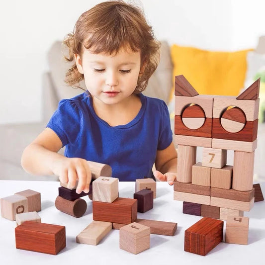 Child playing with wooden blocks on a white surface