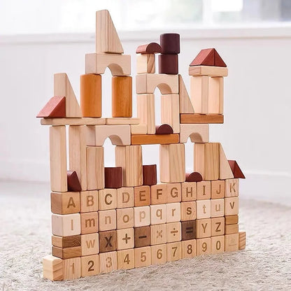 Wooden building blocks with letters and numbers on a light surface