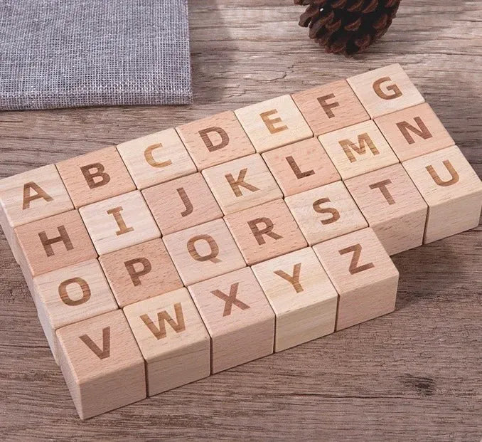 Wooden alphabet blocks on a wooden surface