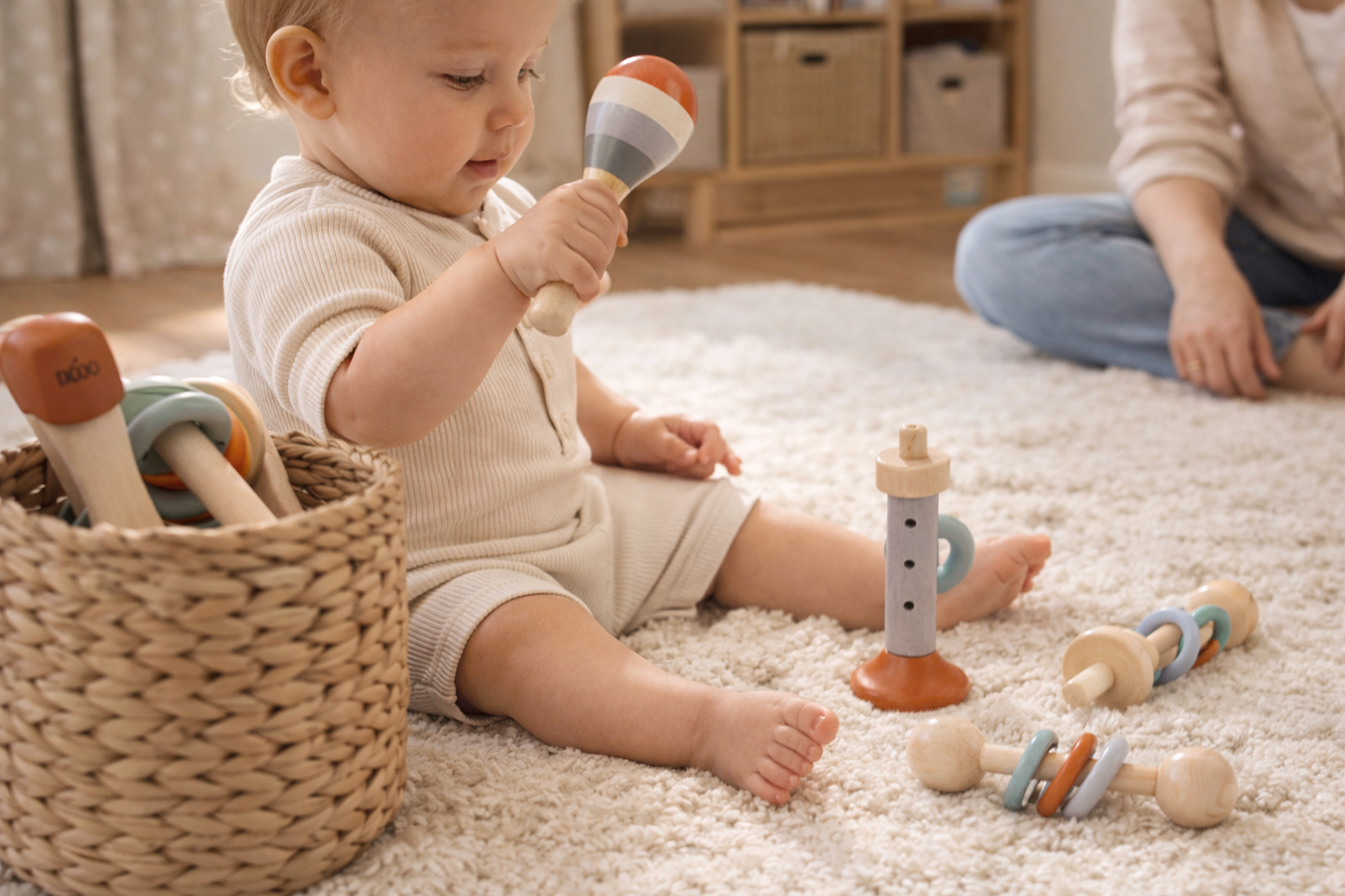 Baby playing with wooden instrument toys on a carpeted floor