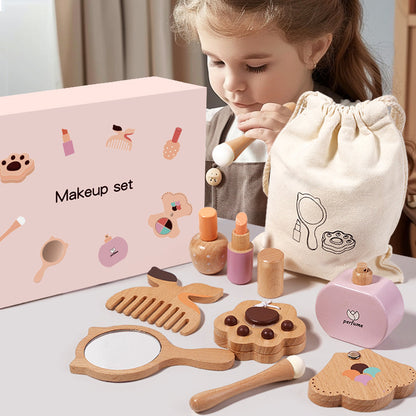 Child playing with a wooden toy makeup set on a table.