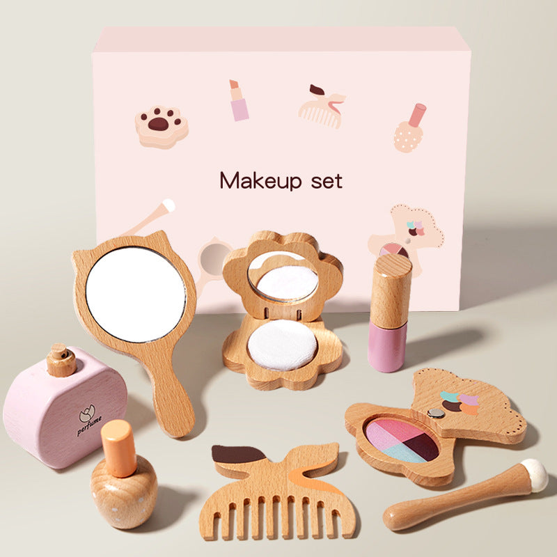 Wooden toy makeup set with various items including a mirror, blush, and comb on a light background.