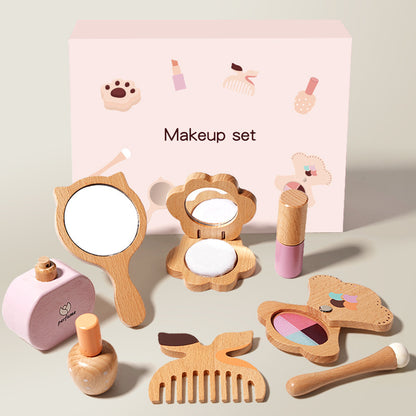 Wooden toy makeup set with various items including a mirror, blush, and comb on a light background.