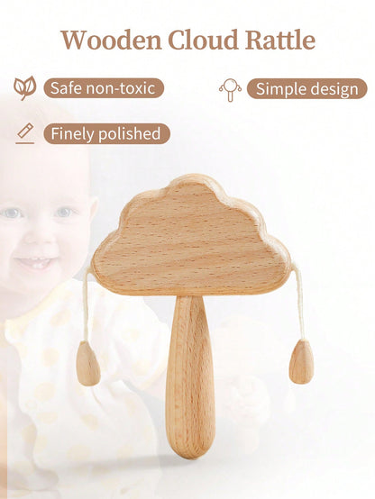 Wooden cloud rattle with safety and design features on a light background
