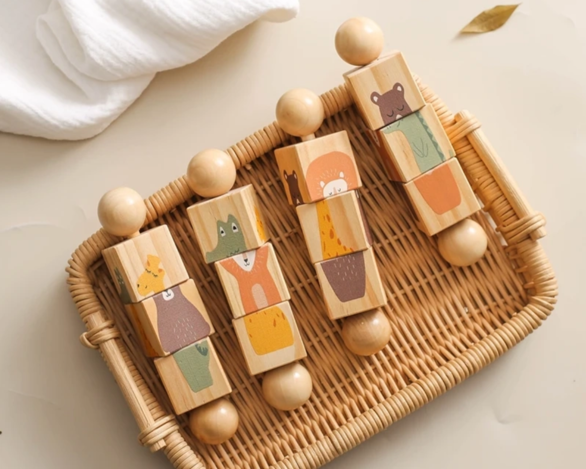 Wooden blocks with animal designs on a woven tray