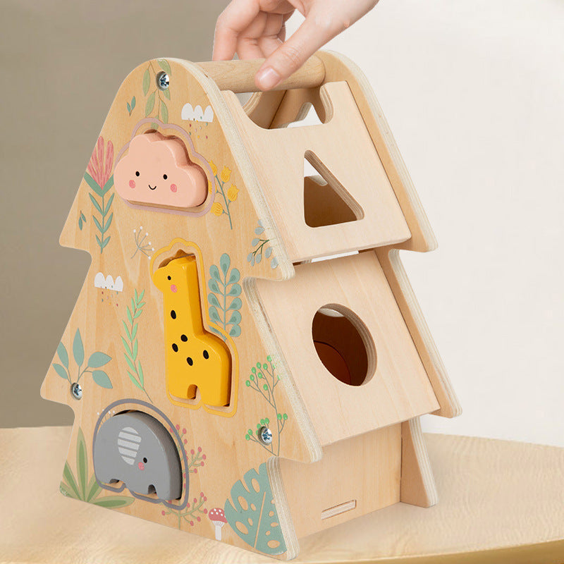 Wooden shape sorter toy with animal cutouts on a neutral background