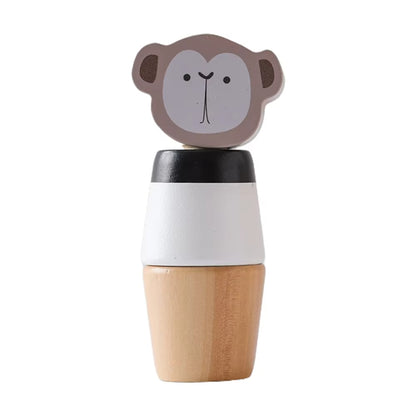Wooden toy figure of a monkey with a white body and brown top hat on a white background