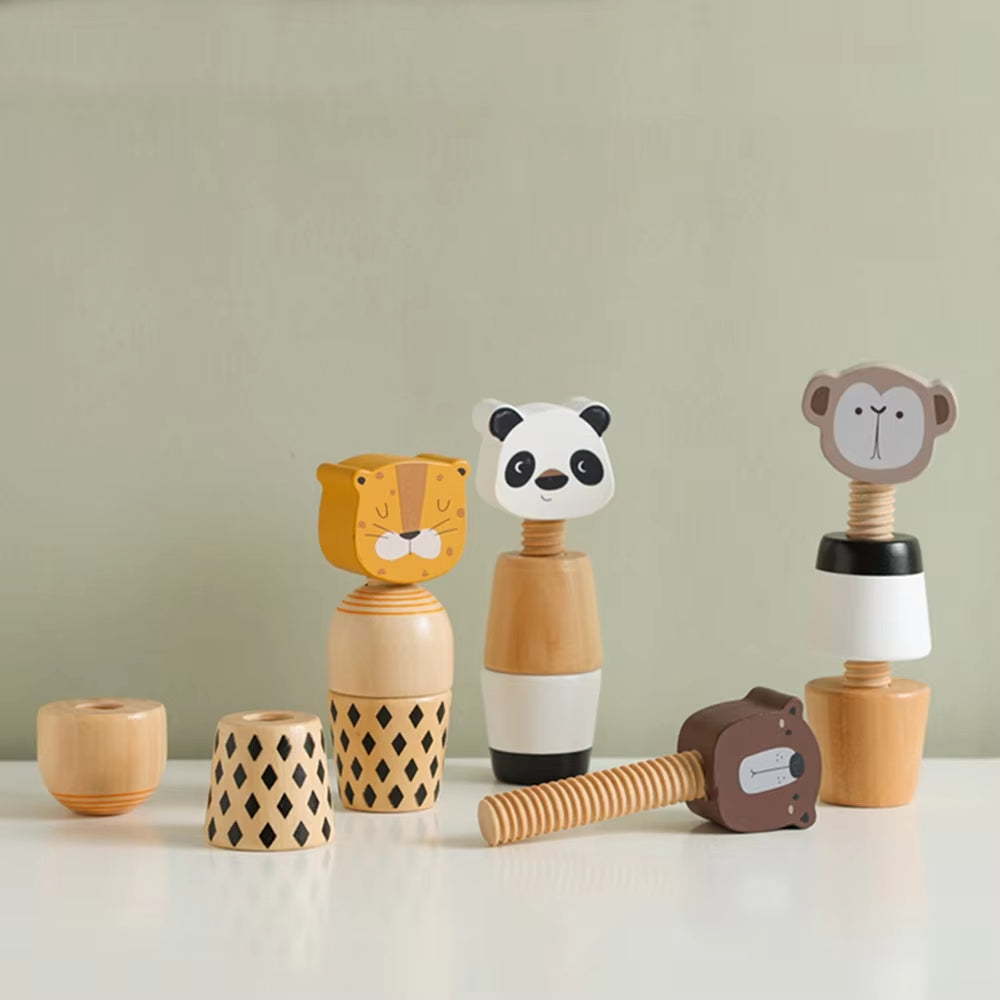 Set of wooden toys with animal faces on a light green background