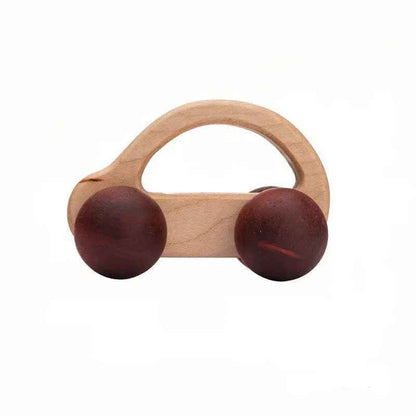 Wooden baby rattle with brown rubber rings on a white background