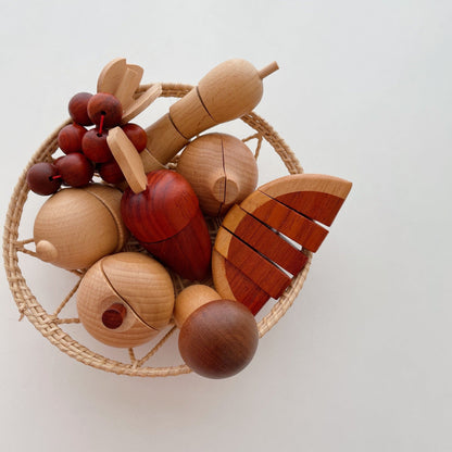 Wooden fruit-shaped toys on a white background