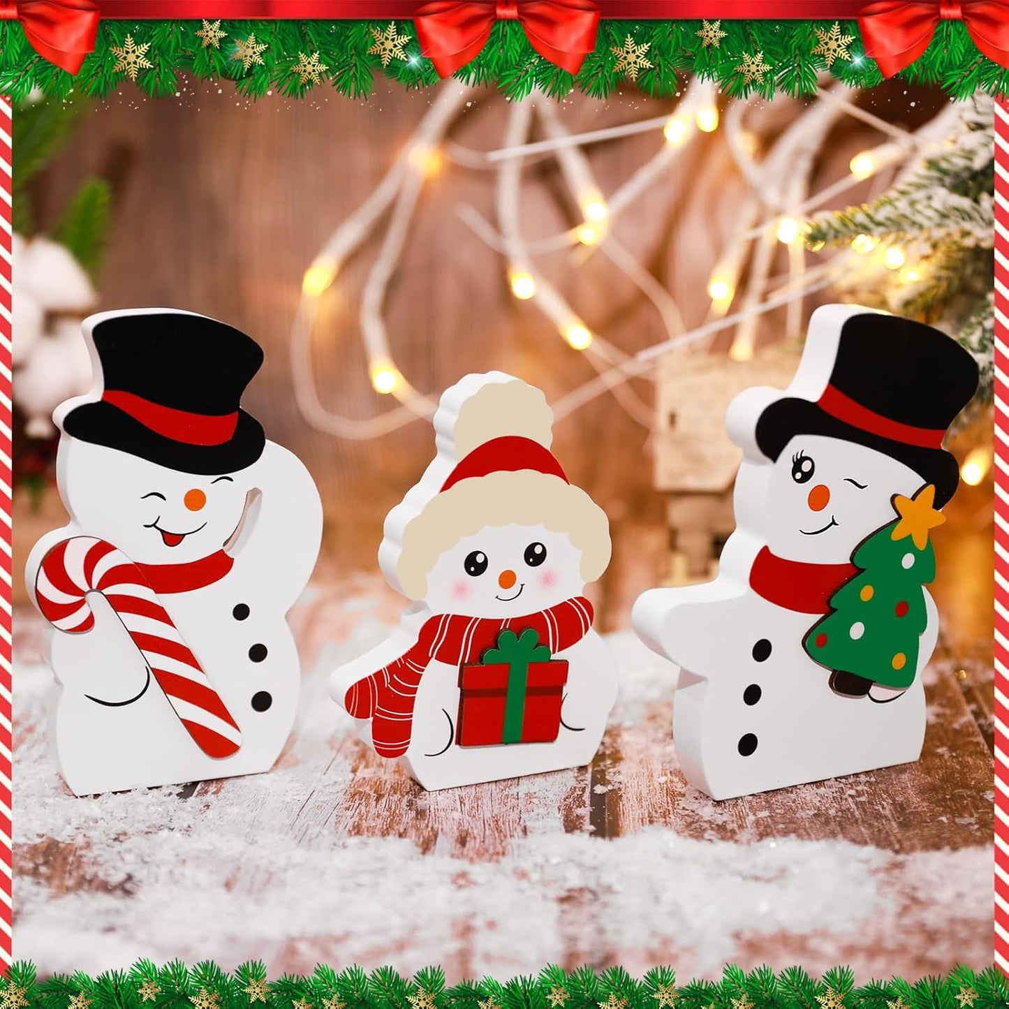 Three snowman figurines with festive accessories on a wooden surface, surrounded by Christmas decorations.