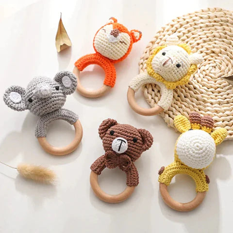 Set of animal-themed teething rings on a light background