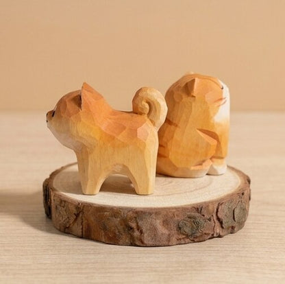Wooden dog and cat figurine on a wooden base with a warm glow