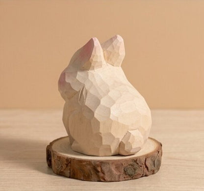 Angled view hand carved wooden animal toy rabbit sheep design, geometric faceted natural wood finish, Montessori educational toy for toddlers developmental play and storytelling activities